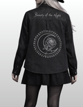 Women in black denim with gothic patchwork